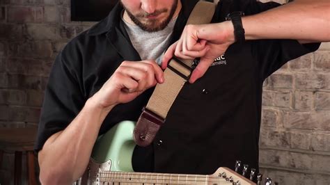 how to put on guitar strap electric: A Comprehensive Guide & Delving into the Aesthetics of Guitar Accessories